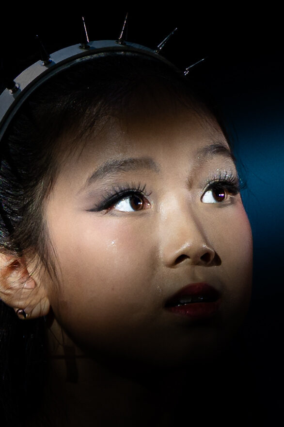 Close-up of young performer in spiked headpiece, Six: Teen Edition